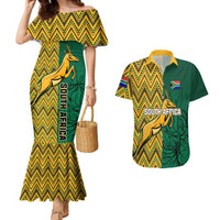 Yellow mermaid dress with zigzag chevron and springbok graphic, paired with green Hawaiian shirt