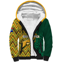 Sherpa hoodie with yellow, green tribal print panels and black ribbed cuffs, front view