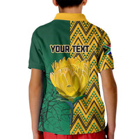 Kids personalized polo shirt back, green with yellow chevron pattern and 'YOUR TEXT' print