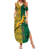 Women’s green and yellow off-shoulder maxi dress with zigzag and springbok print