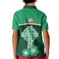 Green kid polo shirt with back graphic of harp cross and shamrocks