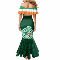 Green mermaid dress with off-shoulder striped yoke and circular shamrock graphic