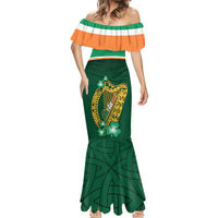 Green mermaid dress with off-shoulder striped yoke and gold harp with shamrock accents