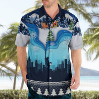 Blue holiday Hawaiian shirt with blue cityscape, trees, and snowflake prints; short sleeves.