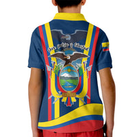 Kids blue polo shirt back view with large crest graphic and multicolor stripes