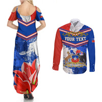 Long-sleeve button shirt with red/blue chevrons and large flower graphic on blue base