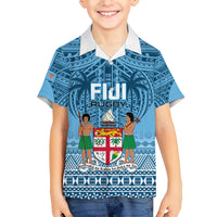 Blue short-sleeve collared rugby shirt for kids, front graphic with Fiji text and figures
