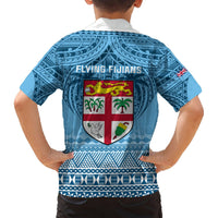 Blue short-sleeve rugby shirt with collar, back Flying Fijians crest in shield pattern