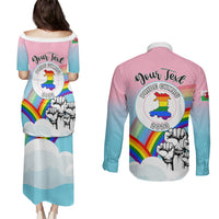 Back view: gradient pink-to-blue pride dress and long-sleeve button shirt with crest and dragon