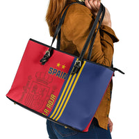Spain flag style leather tote bag with black handles, buckles, and zip closure
