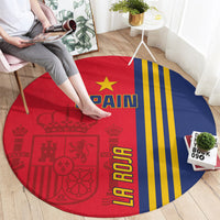 Round Spain flag carpet on the floor, red and blue halves with yellow stripes and gold stars