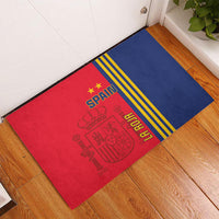 Red and blue Spain football rubber doormat on wood floor with SPAIN crest and yellow stripes