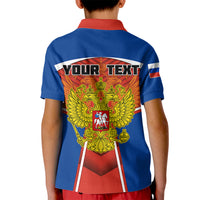 Kids blue polo shirt with red and yellow crest back graphic and short sleeves