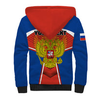 Blue unisex sherpa hoodie with red hood, large gold eagle emblem on front