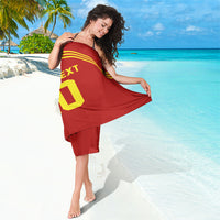 Red Spain-style sarong with yellow stripes and partial 'TEXT 10' print