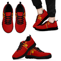 Red low-top sneakers with yellow-red side stripe and black laces, black outsole
