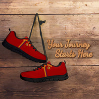 Red athletic sneakers with yellow-red side stripe, black laces, black outsole