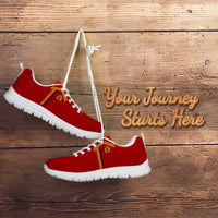 Red athletic sneakers with yellow-red side stripe, white laces, black outsole