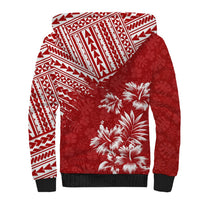 Red sherpa-lined hoodie with white tribal pattern and large palm tree graphic on chest