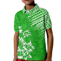 Kids green polo shirt with white floral and geometric Polynesian print, short sleeves