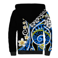 Sherpa-lined unisex hoodie, black back with large blue circular motif and floral prints