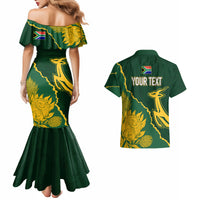 Mermaid dress and green Hawaiian shirt with gold kente-style graphic