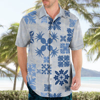 Blue-and-white floral Hawaiian button-up shirt on adult model, short sleeves