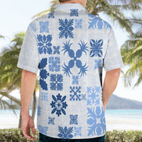 Blue-and-white floral Hawaiian button-up shirt on adult model, back view