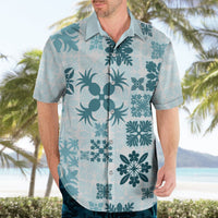 Light teal Hawaiian shirt with floral and palm graphics, short sleeves, button-front