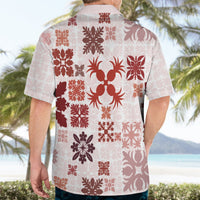 Red-and-cream Hawaiian shirt back, camp collar, short sleeves, dense floral print.