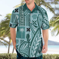 Teal Hawaiian shirt worn by model, camp collar and button placket with tapa pattern.