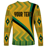 Long-sleeve shirt with yellow kente pattern, green trim, black diagonal stripe, 'Your Text' spot