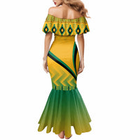 Yellow off-shoulder mermaid dress with green geometric band and tiered flare hem