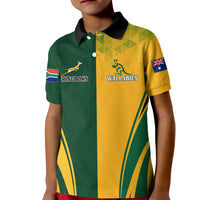Kids rugby polo shirt with green/yellow panels, black collar, front team emblems