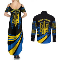 Black maxi dress and black long-sleeve button shirt with blue/yellow emblem wave print