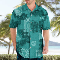 Teal tropical floral leaf print Hawaiian-style button-up shirt with camp collar.