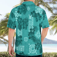 Teal short-sleeve button-up shirt with camp collar and tropical floral leaf back print.