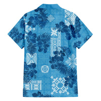 Blue short-sleeve Hawaiian shirt, back view, dark floral with white tapa-style motifs