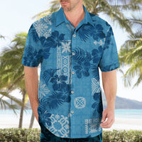 Blue short-sleeve button-up Hawaiian shirt with bold floral print and white vertical panel