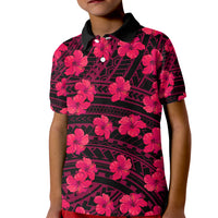 Kids pink hibiscus polo shirt with black tribal pattern, button-up collar, floral print