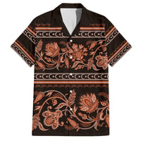 Black Hawaiian shirt with orange-brown floral and ornate border pattern, button-up collar.