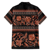 Black Hawaiian shirt back with orange-brown floral ornament and striped border, button-up.