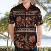 Adult Hawaiian shirt worn: black base with orange-brown floral ornament, short sleeves, buttons.
