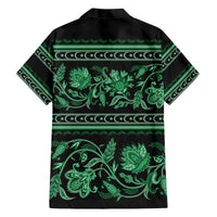 Green Hawaiian shirt back view, short sleeves, collared with floral ornament print.