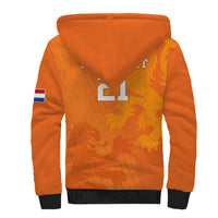 Orange sherpa hoodie with large front graphic, hood up, dark ribbed cuffs and hem
