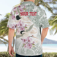 Personalized Hawaiian shirt back view on model with cranes, sakura flowers, and "Your text"
