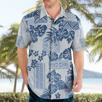 Blue and white Hawaiian print button-up shirt with floral and geometric patchwork pattern