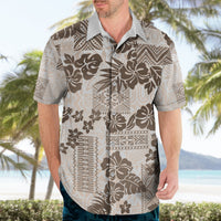 Vintage Hawaiian button-up shirt, front view; cream with dark brown tribal floral print