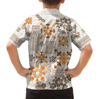 Kids short-sleeve button-up Hawaiian shirt, back view with white, gold, and brown tribal print