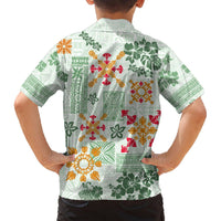 Light green Hawaiian shirt back on child, tapa quilt floral pattern, short sleeves